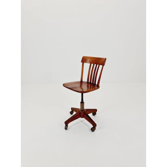 Bauhaus swivel office chair in solid wood 1930s The chair is in good condition Measurements: Height : 75---89 cm Width: 42...