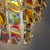 Striking pair of Italian wall sconces from the 1970s, attributed to Vistosi and crafted with iridescent Murano glass...
