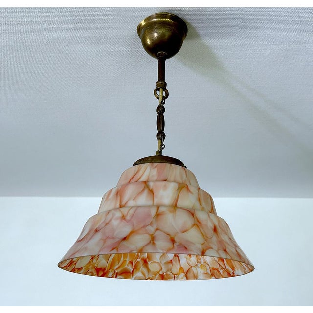 Art Deco pendant light with mottled glass shade in coral pink orange and white, burnished brass suspension Very good...