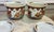 A unique pair of hand painted chinoiserie planters from the 1970s. The planters have intricate detailed moriage like...