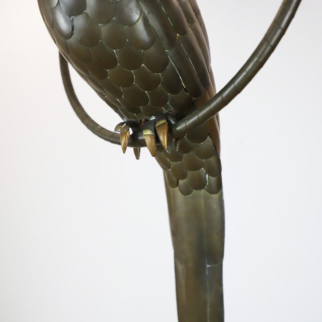 We offer this macaw sculpture by Mexican artist Sergio Bustamante, circa 1960 made in brass and copper with fantastic...