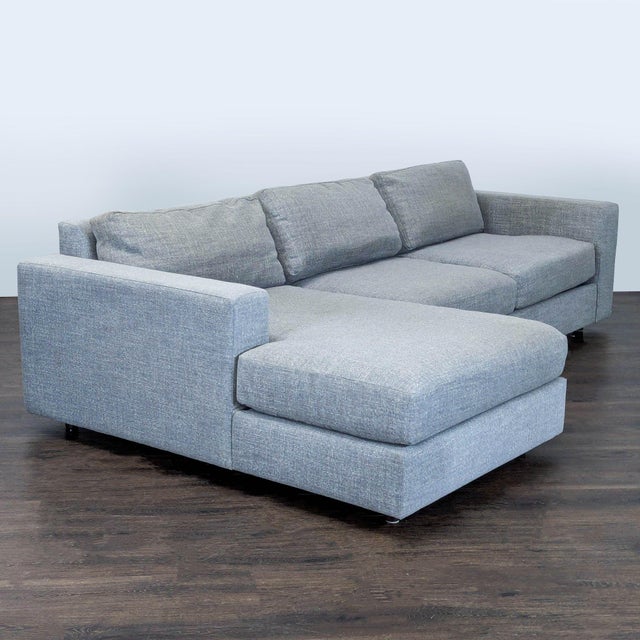 This West Elm sectional features a sleek, modern design in a versatile gray fabric. It includes a spacious left-facing...