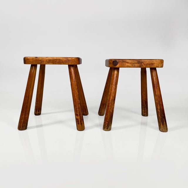 Italian modern rounded square wooden stools, 1970s Pair of rustic wooden stools with rounded square seat and four circular...