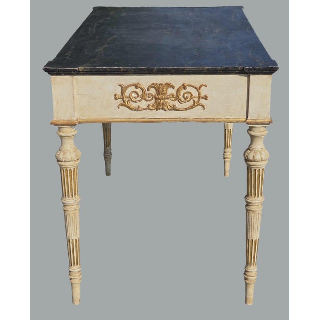 An elegant, highly versatile coffee table that can be used as a console table in an elegant entryway, a writing desk, or...