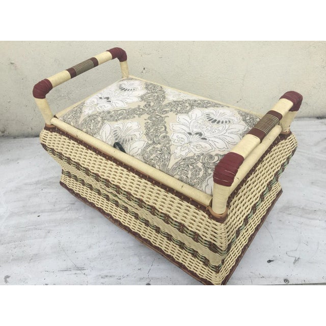 Pouf-ottoman, braided with a synthetic rope and rattan and on the corners of the handle, natural leather, 1950s. Covered...