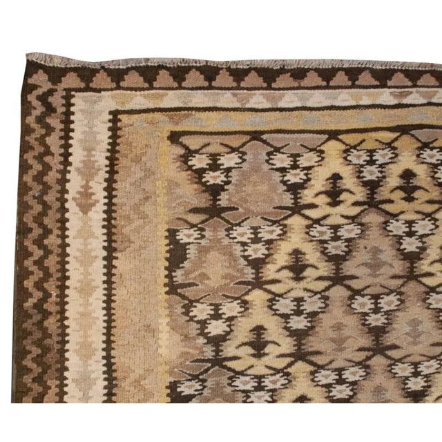An early 20th Century Persian Qazvin Kilim runner with a beautiful all-over tree-of-life pattern, woven with a subtle...