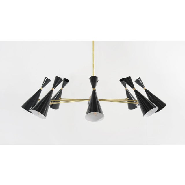 Monolith has design elements of both Italian Modernism and Hollywood glam, in the style of Stilnovo, Arredoluce and...