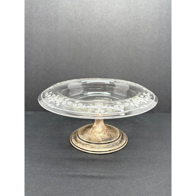 A vintage T.G. Hawkes & Co. crystal compote with floral etching and a sterling silver pedestal base, tentatively dated to...