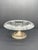 A vintage T.G. Hawkes & Co. crystal compote with floral etching and a sterling silver pedestal base, tentatively dated to...