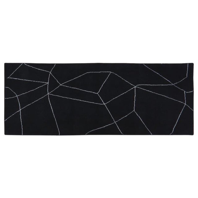 Hand-knotted with care using traditional rug-making techniques, this wool rug blends timeless craftsmanship with a modern...