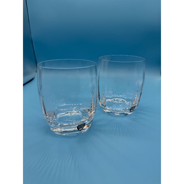 A very beautiful, but difficult-to-find, set of retired Orrefors tumblers. This set contains two, never used old fashioned...