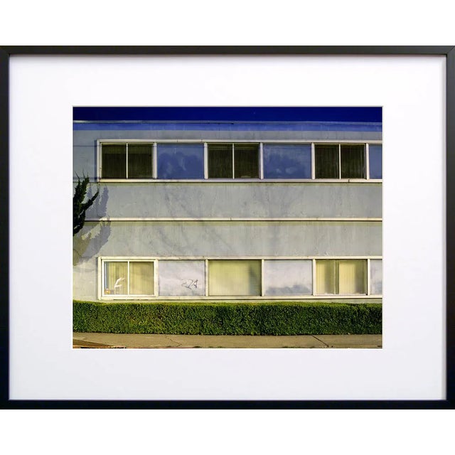 Note from the artist, John Vias: "I like the look of this building. It is all lines and corners, but the colors and hedge...