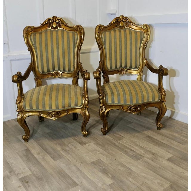 A Stunning Pair of Italian Carved Throne Arm Chairs These large arm chairs are very comfortable the arms legs and back are...