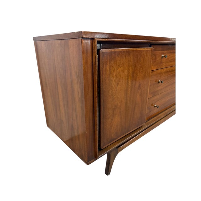 Stunning Mid-Century Modern walnut dresser from the highly desirable Insignia collection by Kent Coffey, dating to the...