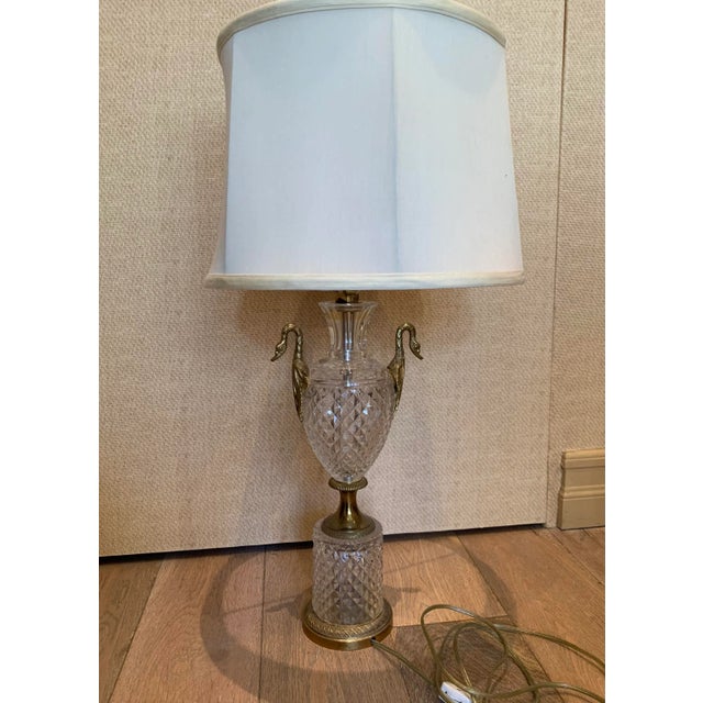 Vintage cut crystal and bronze table lamp with silk shade. Urn shape with swan bronze handles and finial.