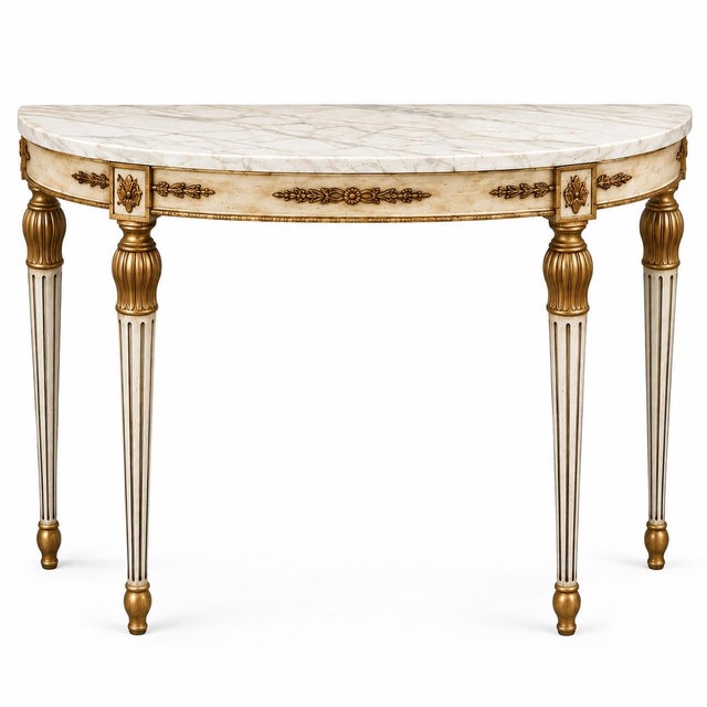 This a neo-classical Louis XVI style demilune marble top console table and matching mirror. It is an offering for a marble...