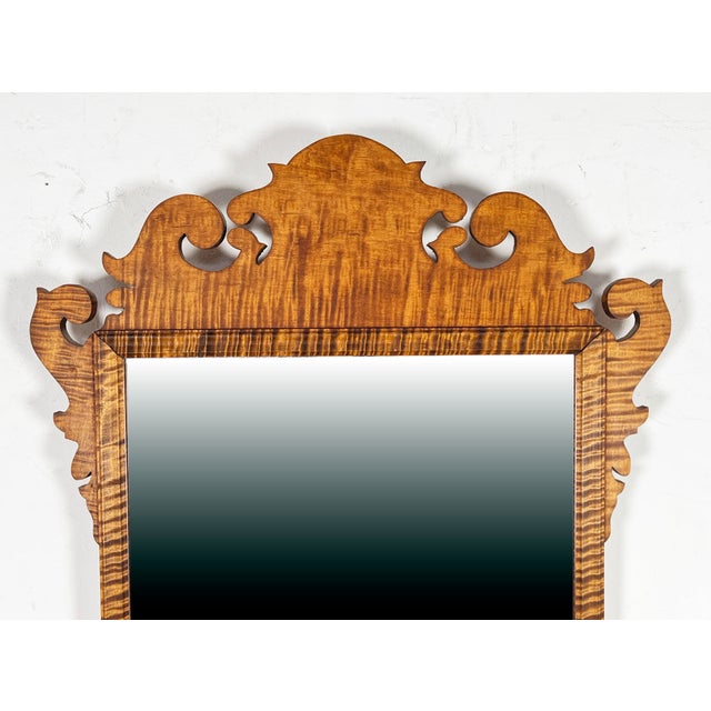 A bespoke tiger maple mirror in the chippendale style by Armand LaMontagne for R. LaMontagne and Sons, dated 1986. Along...