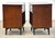 A pair of mid century modern mahogany two drawer nightstands with steel knobs made by RWAY Furniture. Professionally...