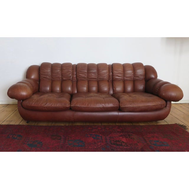 Highly individual Italian mid century large and voluminous leather 3- seater Chesterfield sofa, dating from about 1970....