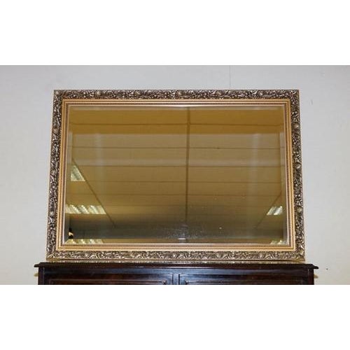 Lovely silver & gold Antique finish bevelled mirror. This mirror is in good condition, and very beautiful. Dimensions: 97...