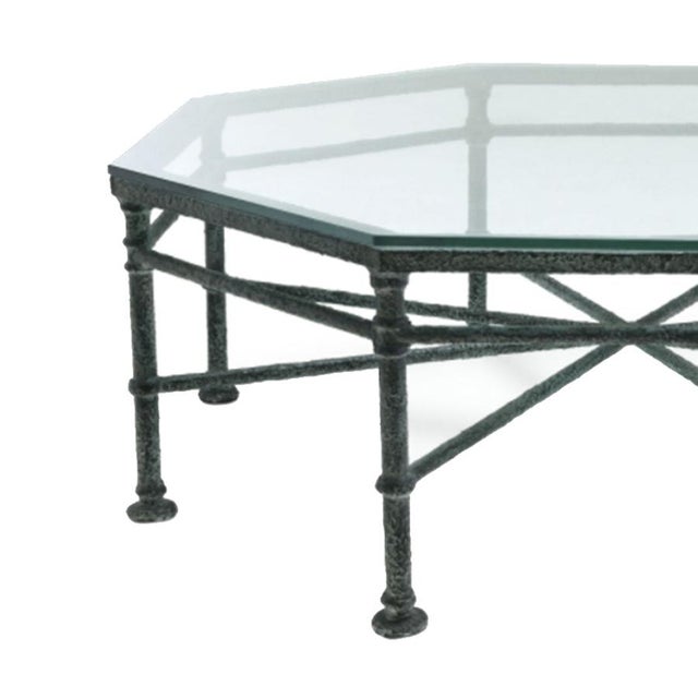 The Lorenzo Coffee Table is crafted with an oxidized iron frame with a star stretcher leading to each angle. The octagonal...