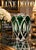This is a heavy, bulbous crystal vase featuring a vibrant emerald green overlay cut back to clear glass in an intricate...