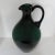 Mid-century Italian heavy blown glass pitcher in deep pine green with a solid glass handle in the same shade. From the...
