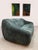 This vintage lounge sofa from the 1970s is upholstered in a deep green-tinted corduroy and features a soft, organic...