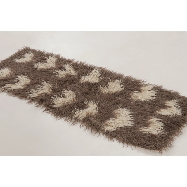 Hand-knotted in wool, this vintage 2x6 Turkish Tulu shag runner embodies the sculptural beauty of mid-century high-pile...