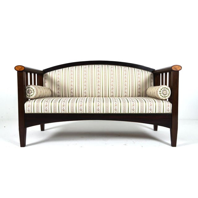 A finely upholstered (JAB Germany fabric) northern European Empire sofa / settee with bolster cushions. The sofa is well...