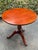 Ethan Allen British classics lamp table in Cinnabar finish. Features a round top that sits on a pineapple carved pedestal...