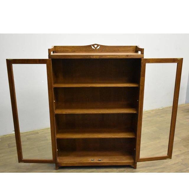 Introduce timeless elegance to your home with the Mission Bookcase / Curio Cabinet - Walnut (W1). This striking piece,...