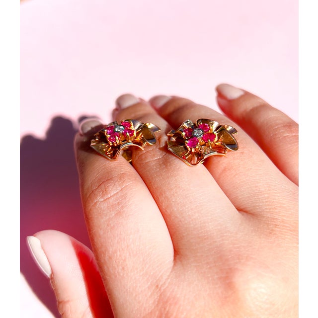 About These Earrings: These Vintage Retro Diamond and Ruby Earrings are crafted in 14K rose gold and platinum, showcasing...
