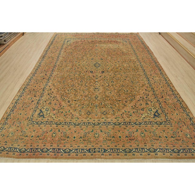 This authentic vintage traditional Kashan rug is hand-knotted with an all-wool pile on a cotton foundation. This oriental...