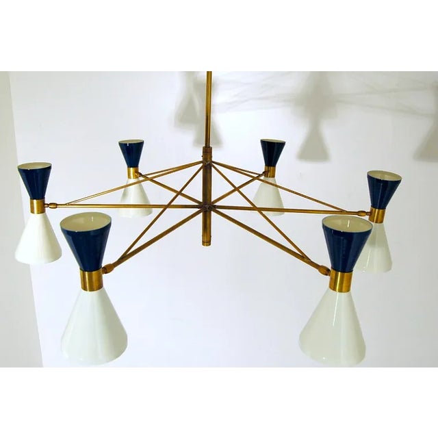This elegant diabolo chandelier has been made in the pure tradition of Italian mid-century design. It was handmade in...