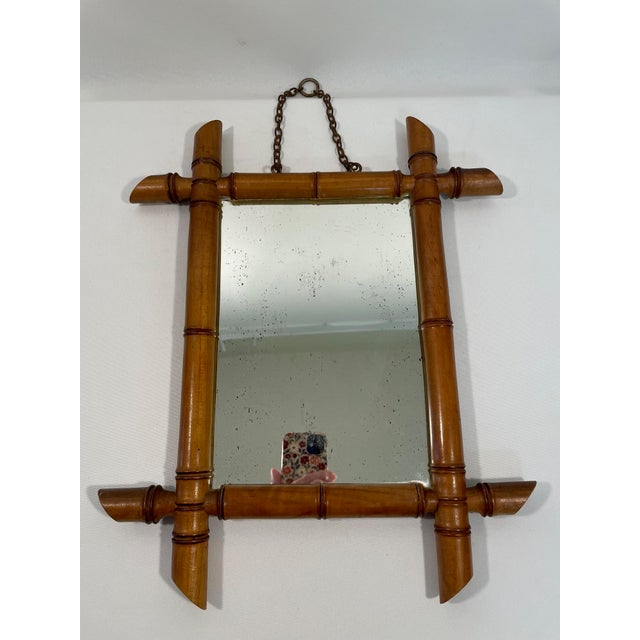 A charming hand crafted and hand turned French Faux Bamboo Wooden Wall Mirror from the early 1900s. Made in France. This...