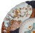 A late 19th century Japanese Imari plate that is very finally painted and with a scalloped edge. Plate is signed in...