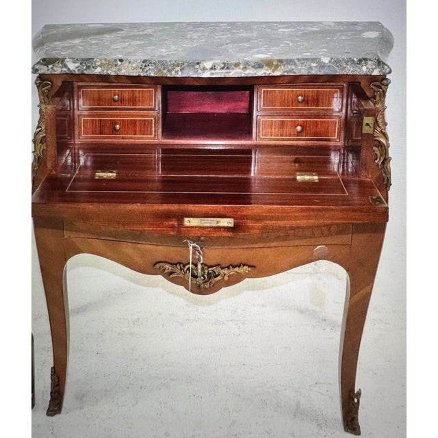 Designed like a Bombay chest this is actually a secretary desk on the first level. Fully functional drawers for storage,...