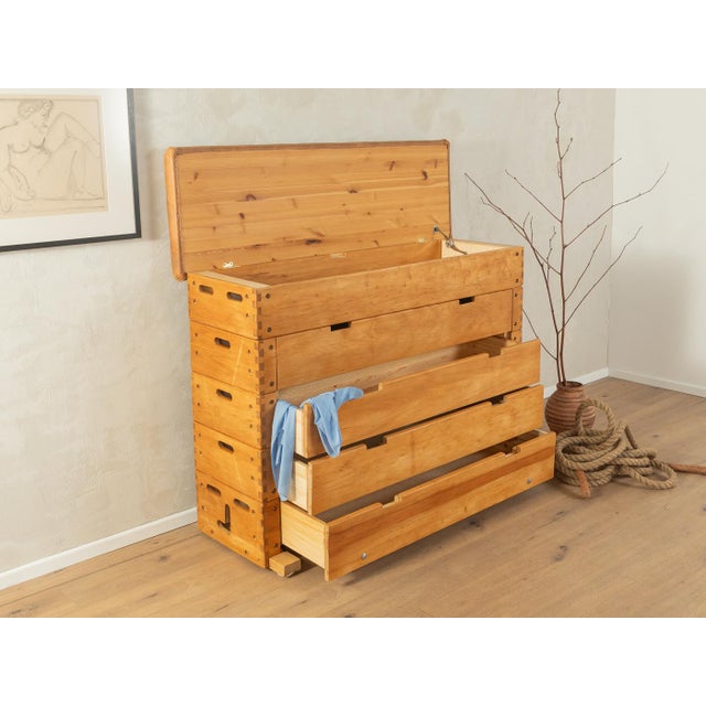 A unique vaulting chest from the 1960s. High-quality beechwood body with four pinewood drawers and a hinged lid with a...