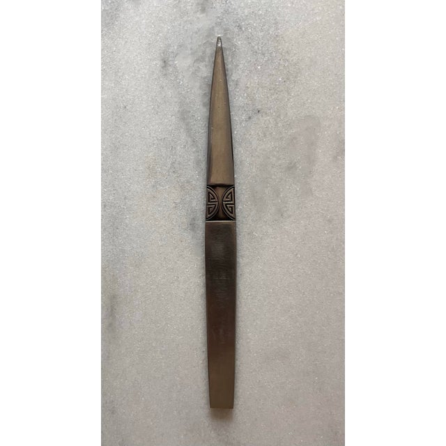 Vintage stainless steel metal letter opener with tribal butterfly design believed to be made in Japan by Astal Rostfrei....