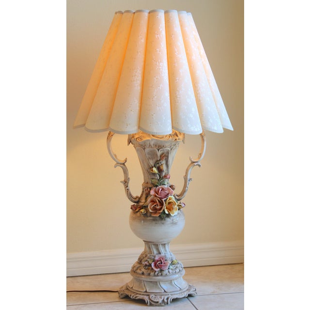 A beautiful pair of vintage Italian Capodimonte-style porcelain table lamps dating to approximately the 1950s–1960s. Each...