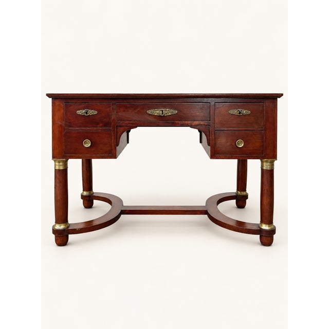 Empire-style mahogany flat desk with a beautiful leather top and brass hardware. Excellent overall condition. Dimensions:...