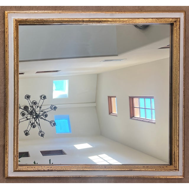 This vintage distressed wood frame has gold leaf and an inner band of hand-painted white paint. The red bole...