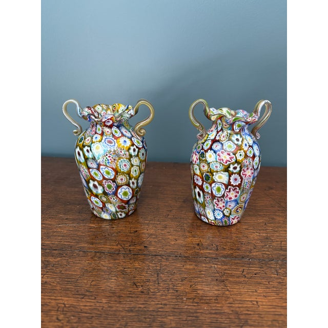 A pair of matched Murano millefiori double handled vases from the school of Fratelli Toso. They are approximately 5 inches...