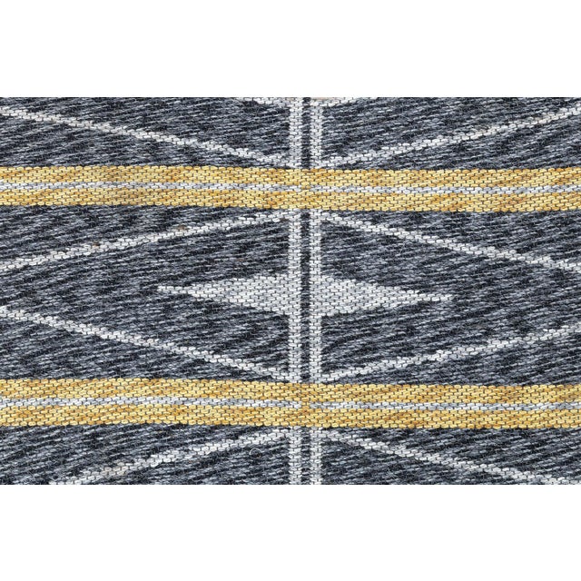 This 1952 Vintage Double-Sided Swedish Rug is a striking example of Scandinavian modern design and craftsmanship....