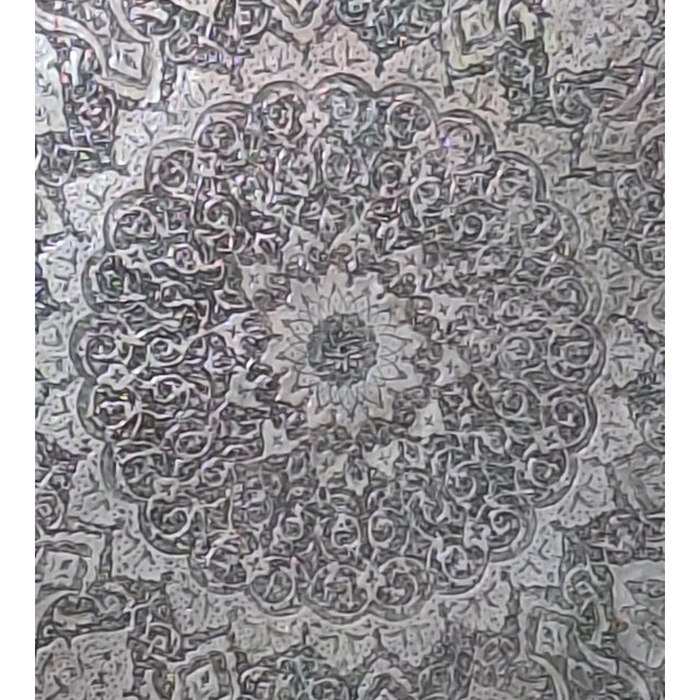 Vintage silver-plated serving tray featuring an intricately engraved floral and arabesque medallion design with a...