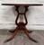 This is a beautiful vintage Duncan Phyfe style mahogany accent table featuring a classic lyre pedestal base, carved...