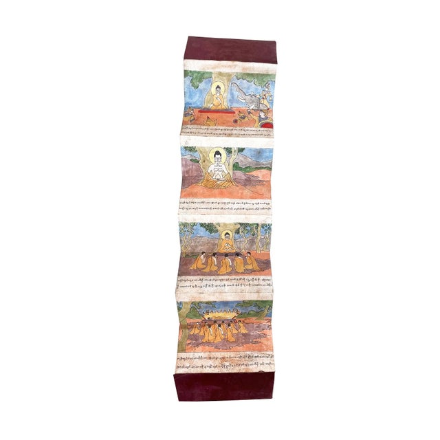 A Burmese folding book. Two-sided manuscript depicts the story of the Buddha from birth to enlightenment to nirvana. Hand-...