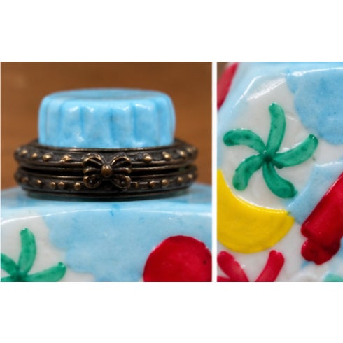Whimsical miniature porcelain hinged trinket box designed as a colorful candy jar or candy bottle. The pale blue glazed...