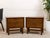 A handsome matching pair of vintage Mid-Century Modern nightstands featuring warm walnut-toned wood, two spacious drawers,...